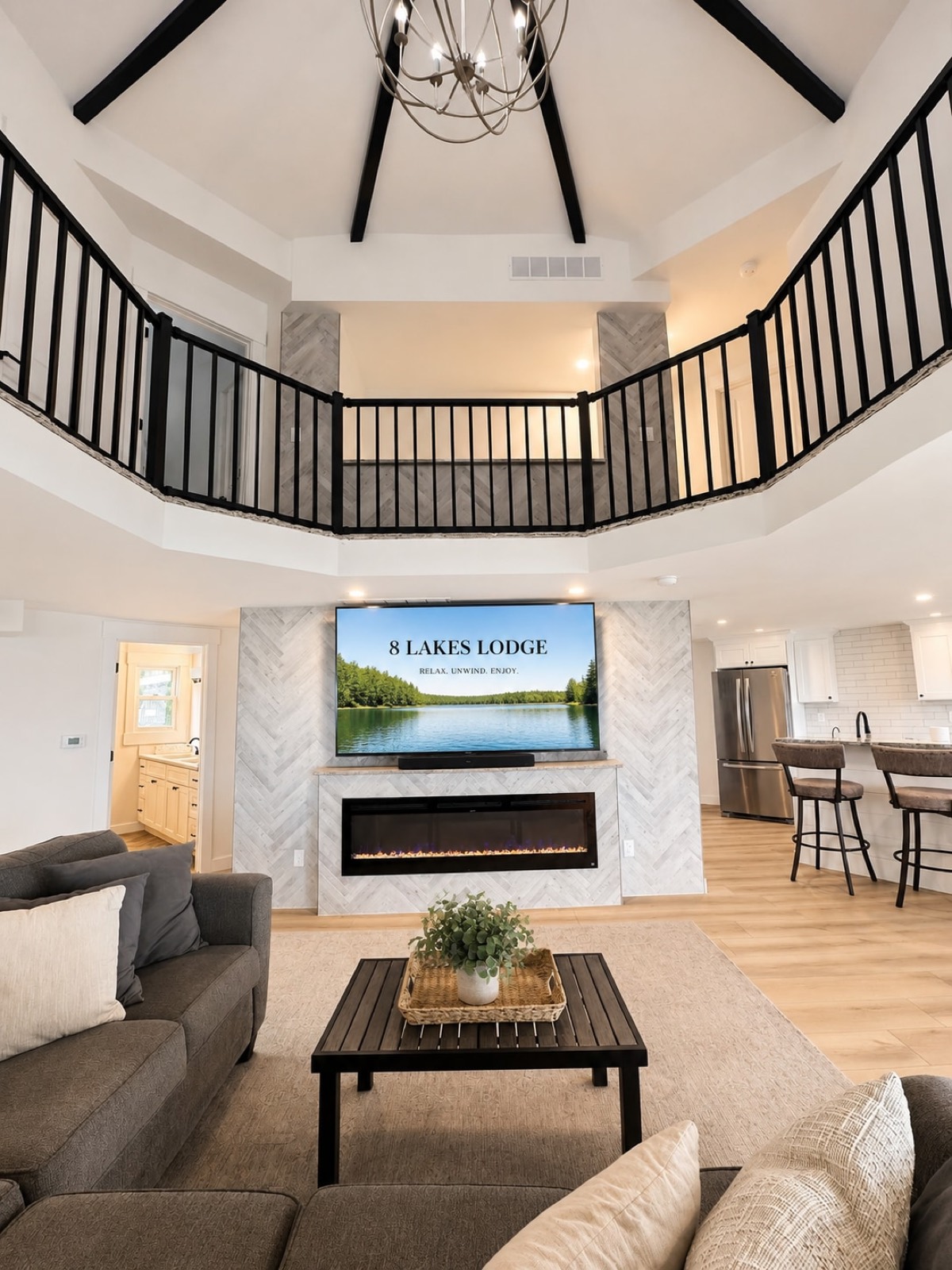 Open-concept great room with 360-degree panoramic lake views