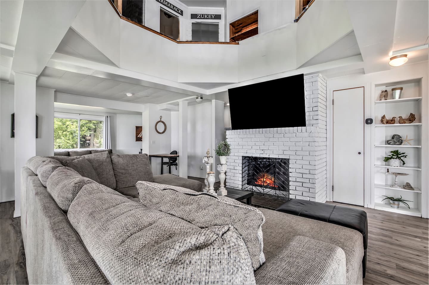 Great room with stone fireplace and built-ins